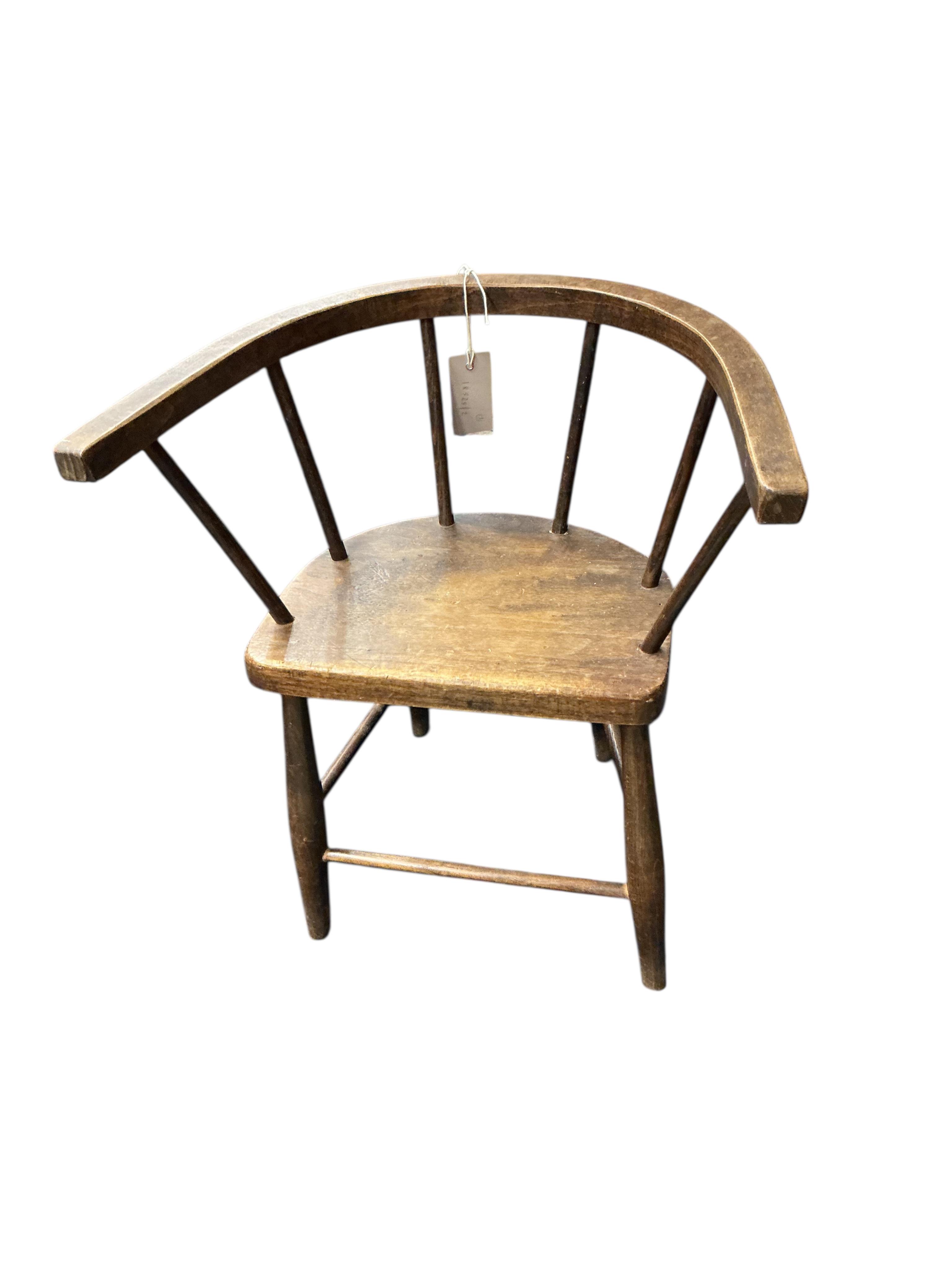 A Victorian mahogany child's rocking lambing commode chair, height 71cm and two later primitive style child’s chairs